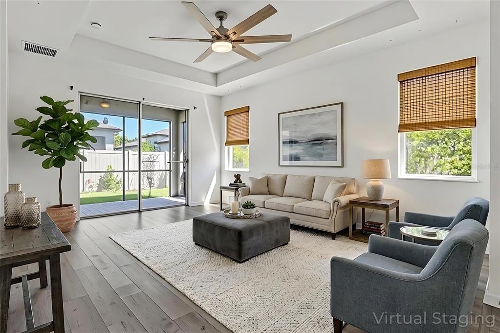 8544 Cache Drive Sarasota, FL 34240 - Photo 3 of 46 a living room with furniture and a large window