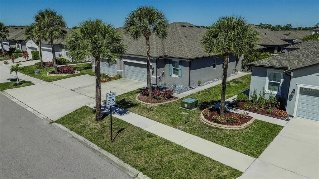 8544 Cache Drive Sarasota, FL 34240 - Photo 43 of 46 a front view of house with yard having patio