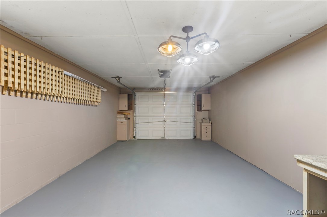 107 Allen Avenue Inglis, FL 34449 - Photo 20 of 36 an empty room with a empty space and chandelier fan