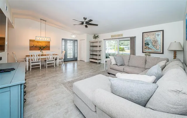 a living room with furniture and a window