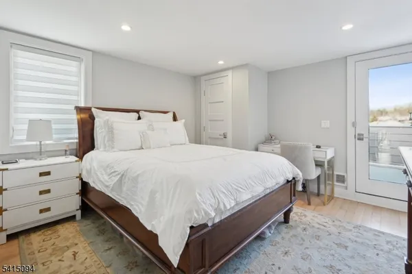 a bed room with a bed and a window