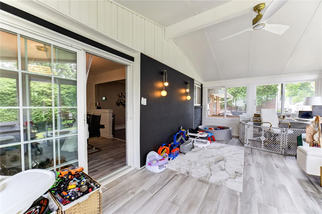 7290 Heather Road Macungie, PA 18062 - Photo 19 of 39 A spacious sunroom offers bright spaces and comfortable flooring, perfect for recreation or work.