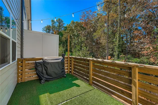 a view of a backyard with sitting area