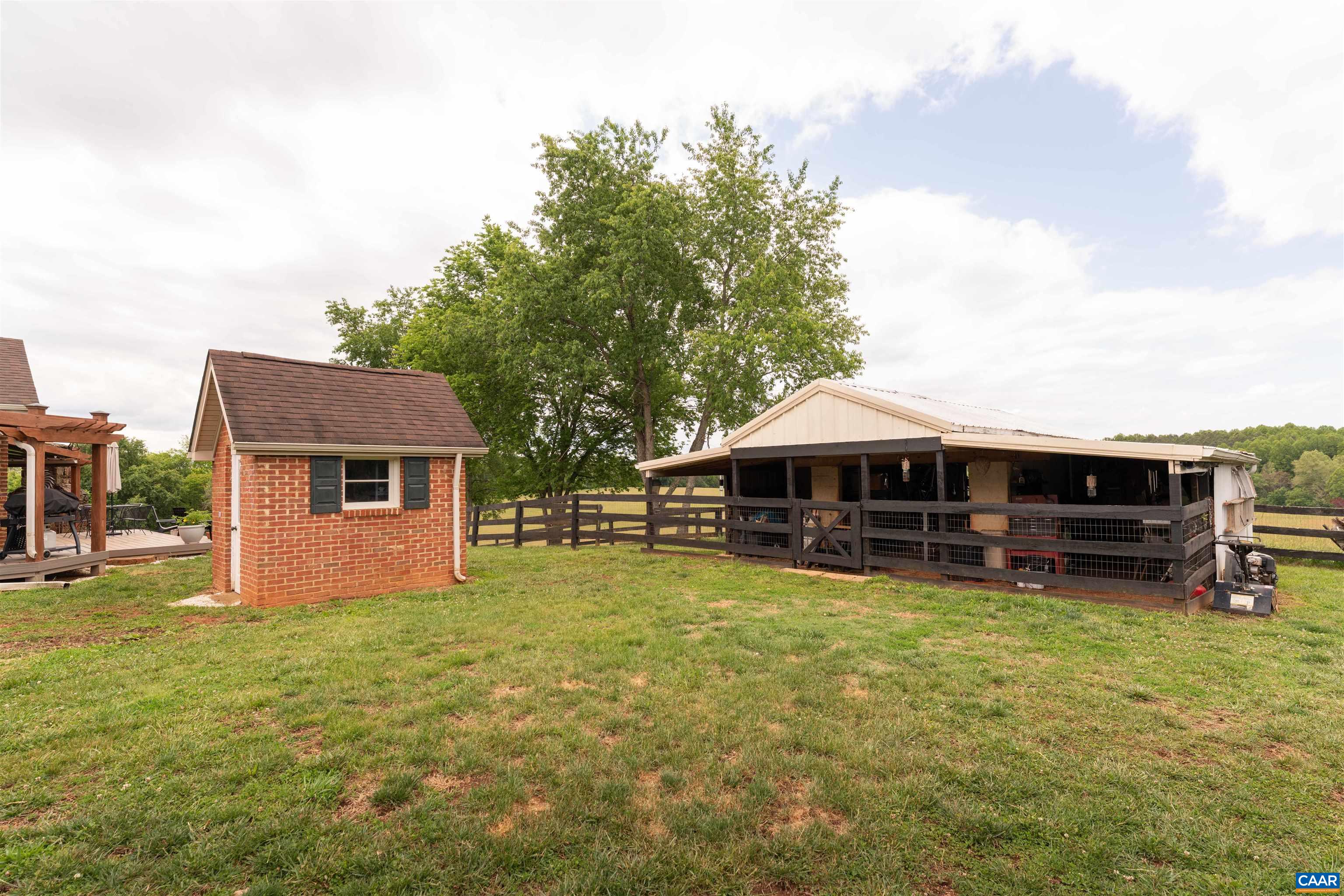 3486 Fredericksburg Road Ruckersville, VA 22968 - Photo 33 of 37 a view of a house with a yard and sitting area