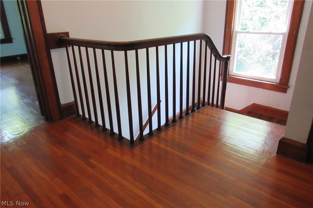 2730 Tryon Road Ashtabula, OH 44004 - Photo 17 of 23 Landing upstairs with original hardwood floors and railing.