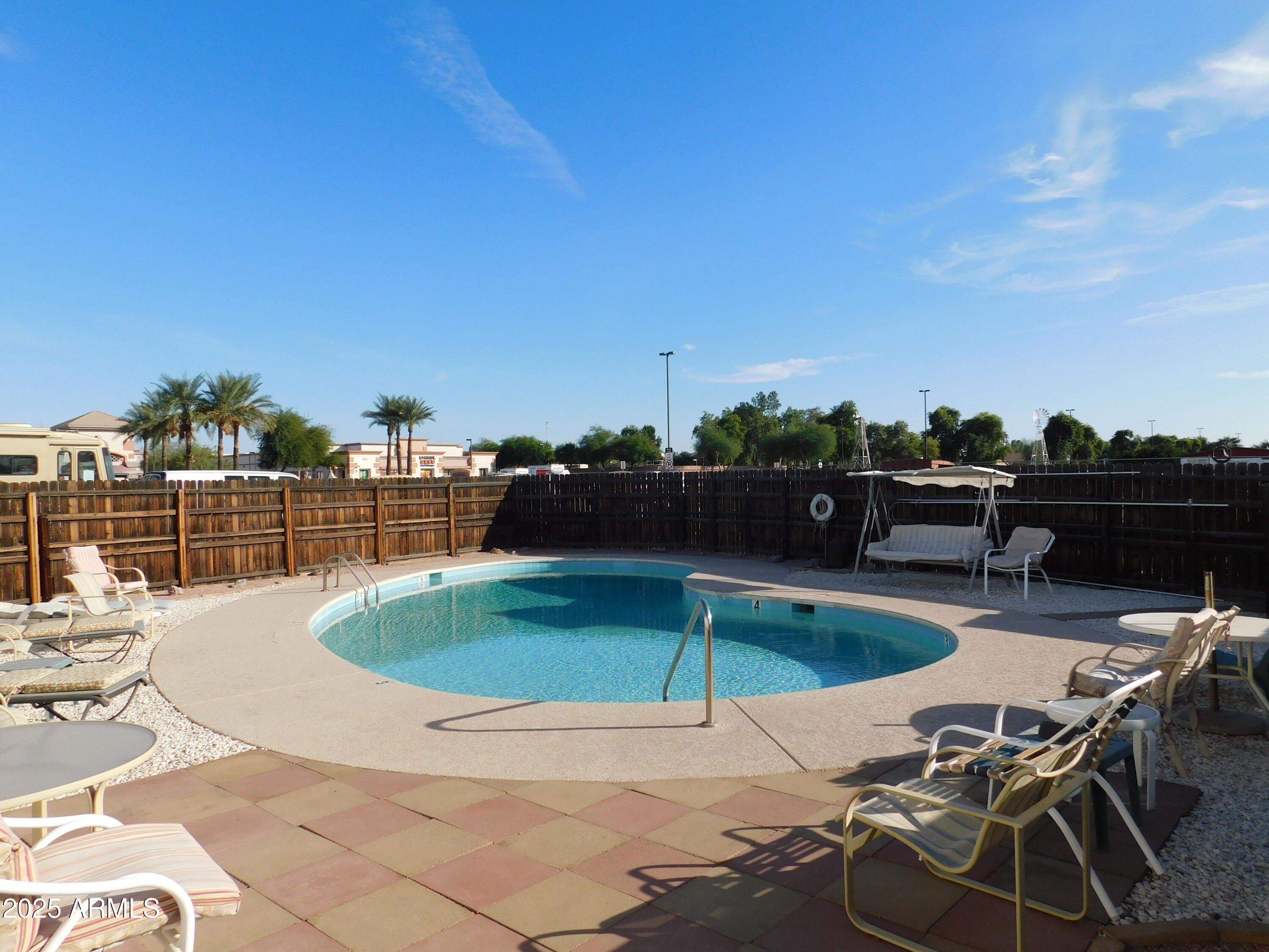 15802 South Gilbert Road, Unit 58 Chandler, AZ 85225 - Photo 16 of 21 a view of a swimming pool with lounge chairs