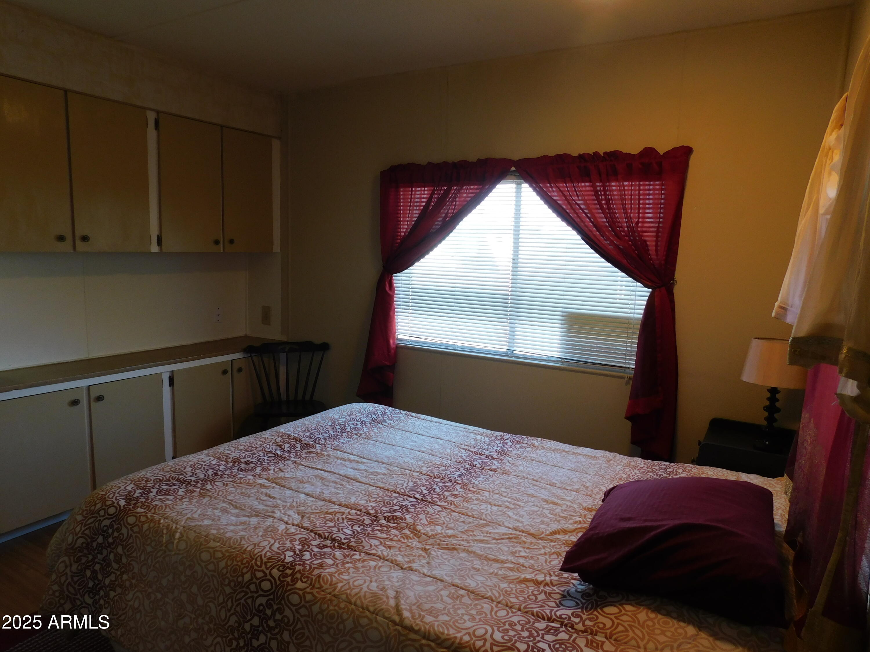 15802 South Gilbert Road, Unit 58 Chandler, AZ 85225 - Photo 10 of 21 a bedroom with a bed and a large window