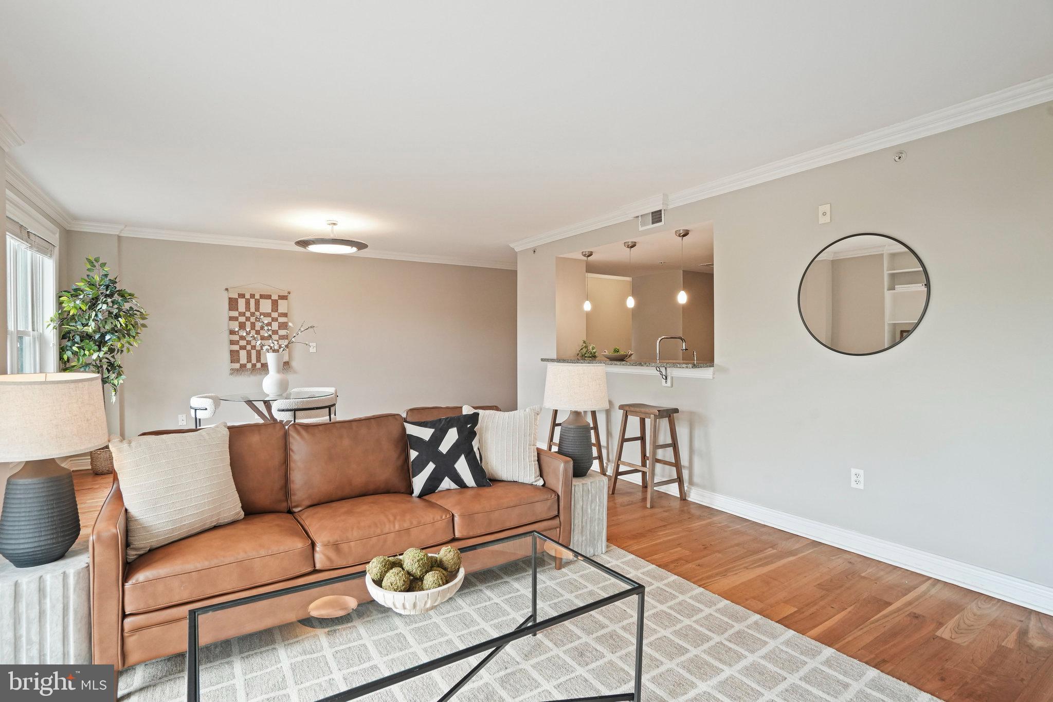 1020 Pennsylvania Ave. Southeast, Unit 404 Washington, DC 20003 - Photo 24 of 24 a living room with furniture and a wooden floor