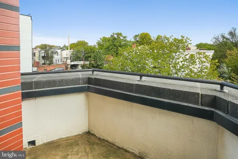 a bedroom with a bed and a chair