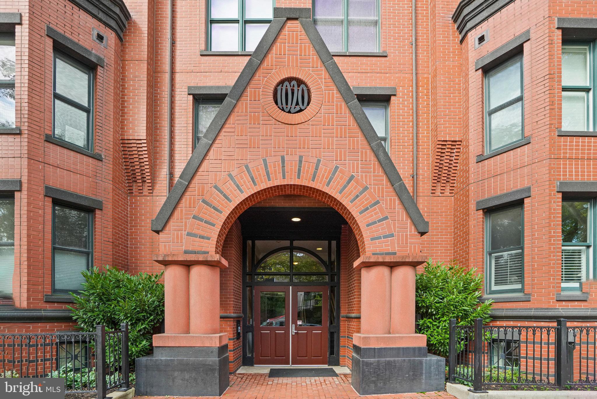 1020 Pennsylvania Ave. Southeast, Unit 404 Washington, DC 20003 - Photo 3 of 24 a view of a house with many windows and a tree