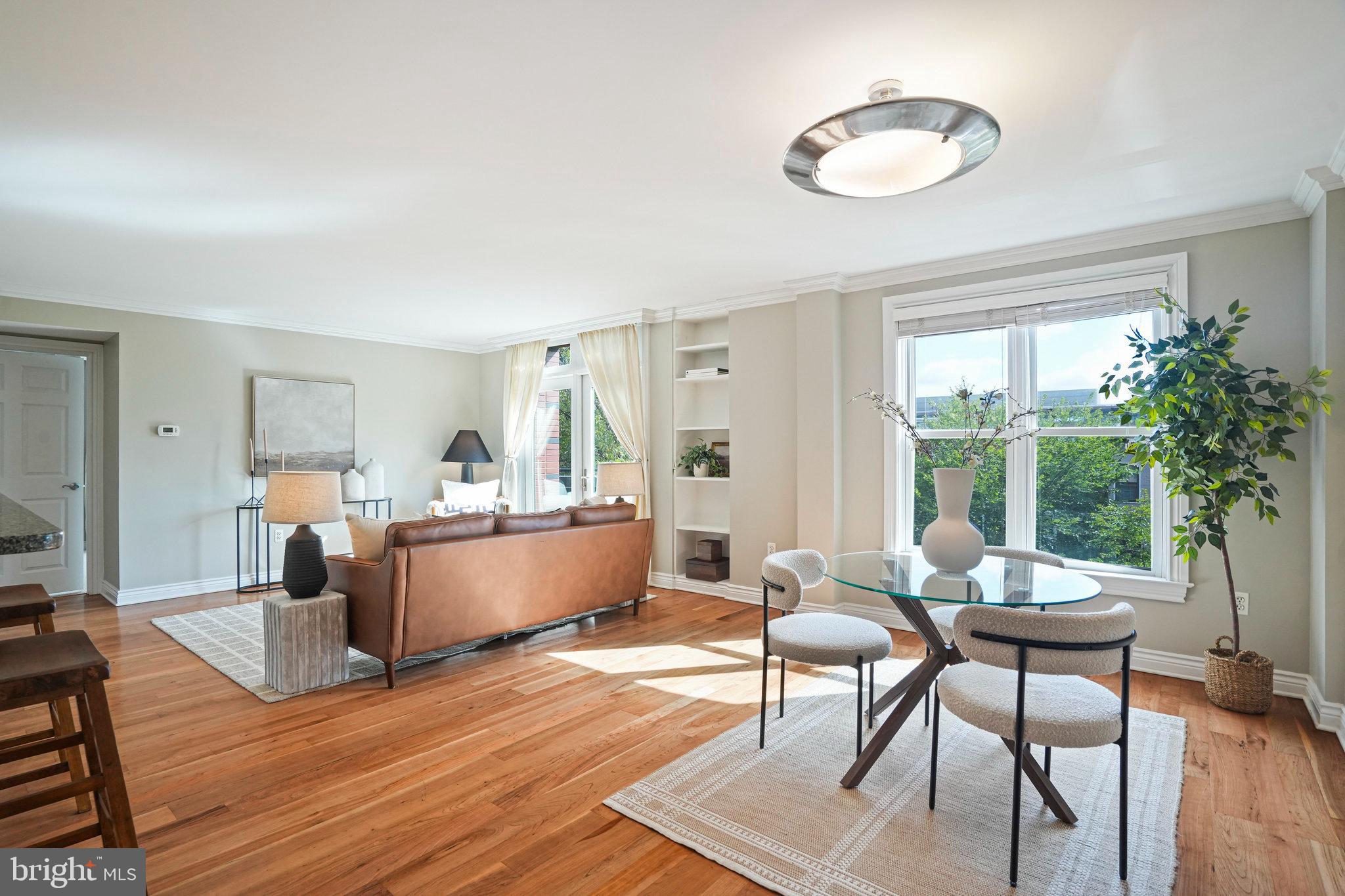 1020 Pennsylvania Ave. Southeast, Unit 404 Washington, DC 20003 - Photo 8 of 24 a living room with furniture and a large window