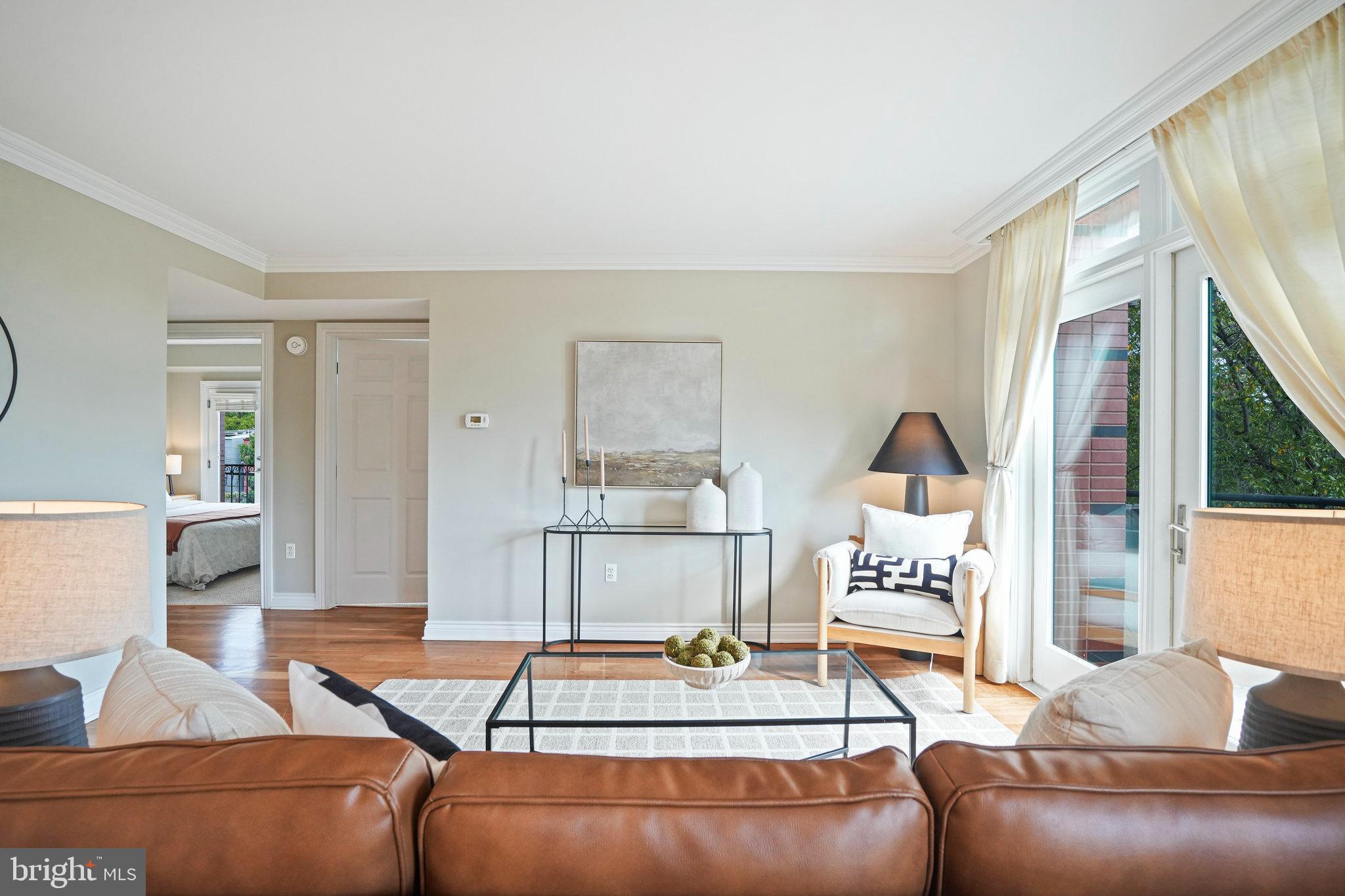 1020 Pennsylvania Ave. Southeast, Unit 404 Washington, DC 20003 - Photo 10 of 24 a living room with furniture and a table