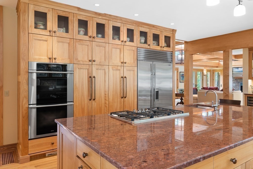 130 Farm Street Dover, MA 02030 - Photo 12 of 39 a kitchen with stainless steel appliances granite countertop a refrigerator and a stove