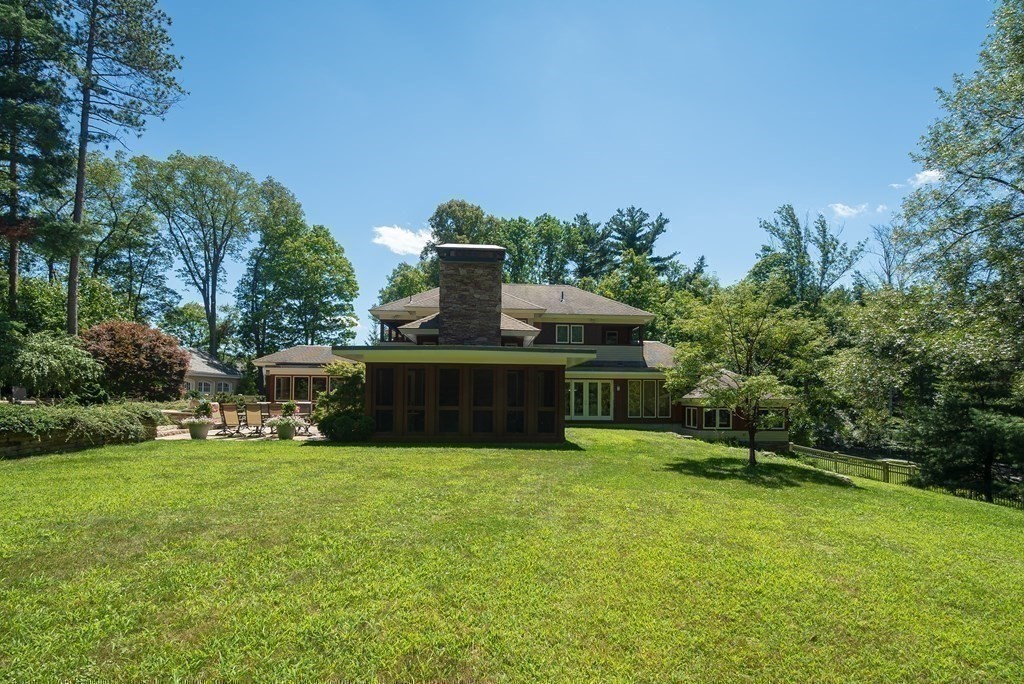 130 Farm Street Dover, MA 02030 - Photo 22 of 39 a view of a house with a yard and sitting area
