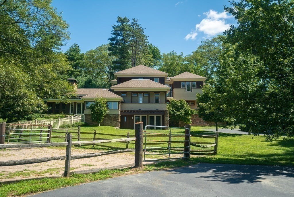 130 Farm Street Dover, MA 02030 - Photo 24 of 39 a front view of a house with a yard