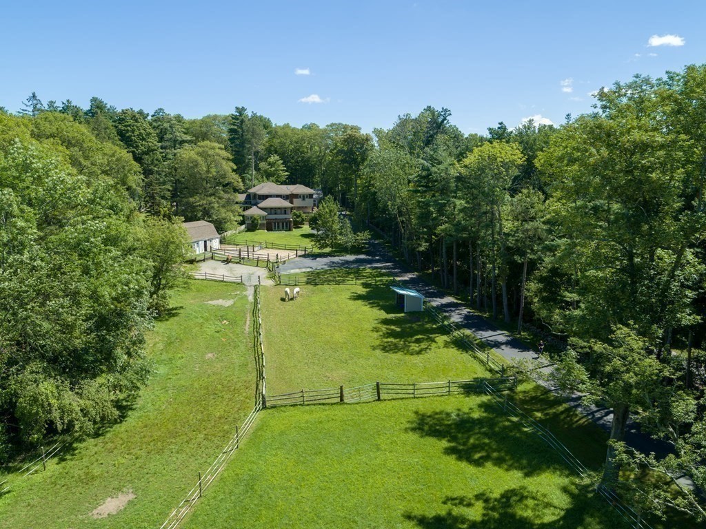 130 Farm Street Dover, MA 02030 - Photo 3 of 39 a view of a garden with large trees