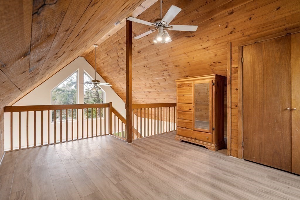 130 Farm Street Dover, MA 02030 - Photo 34 of 39 a view of a porch with wooden floor and fence
