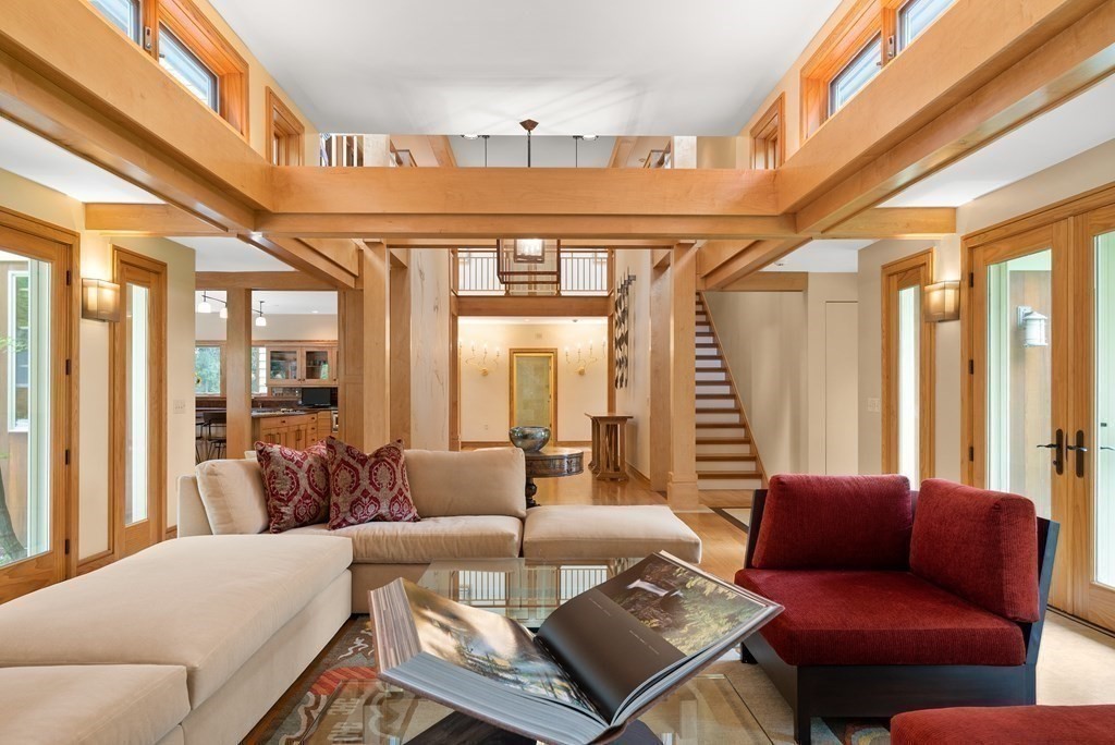 130 Farm Street Dover, MA 02030 - Photo 8 of 39 a living room with furniture and a large window