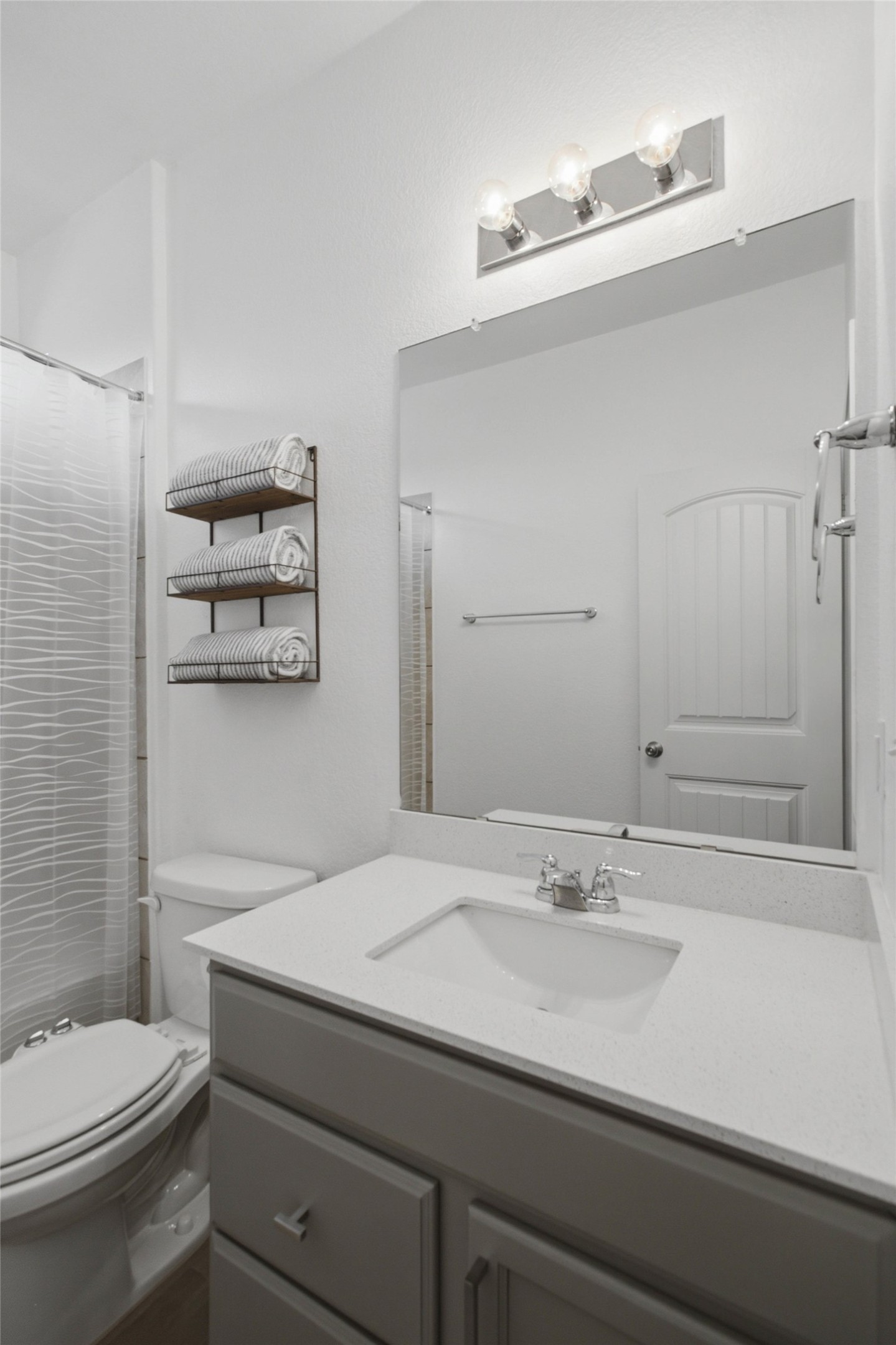 2413 Bridges Ranch Road Georgetown, TX 78628 - Photo 21 of 31 A well-appointed bathroom with a spacious vanity, sleek fixtures, and convenient towel storage.