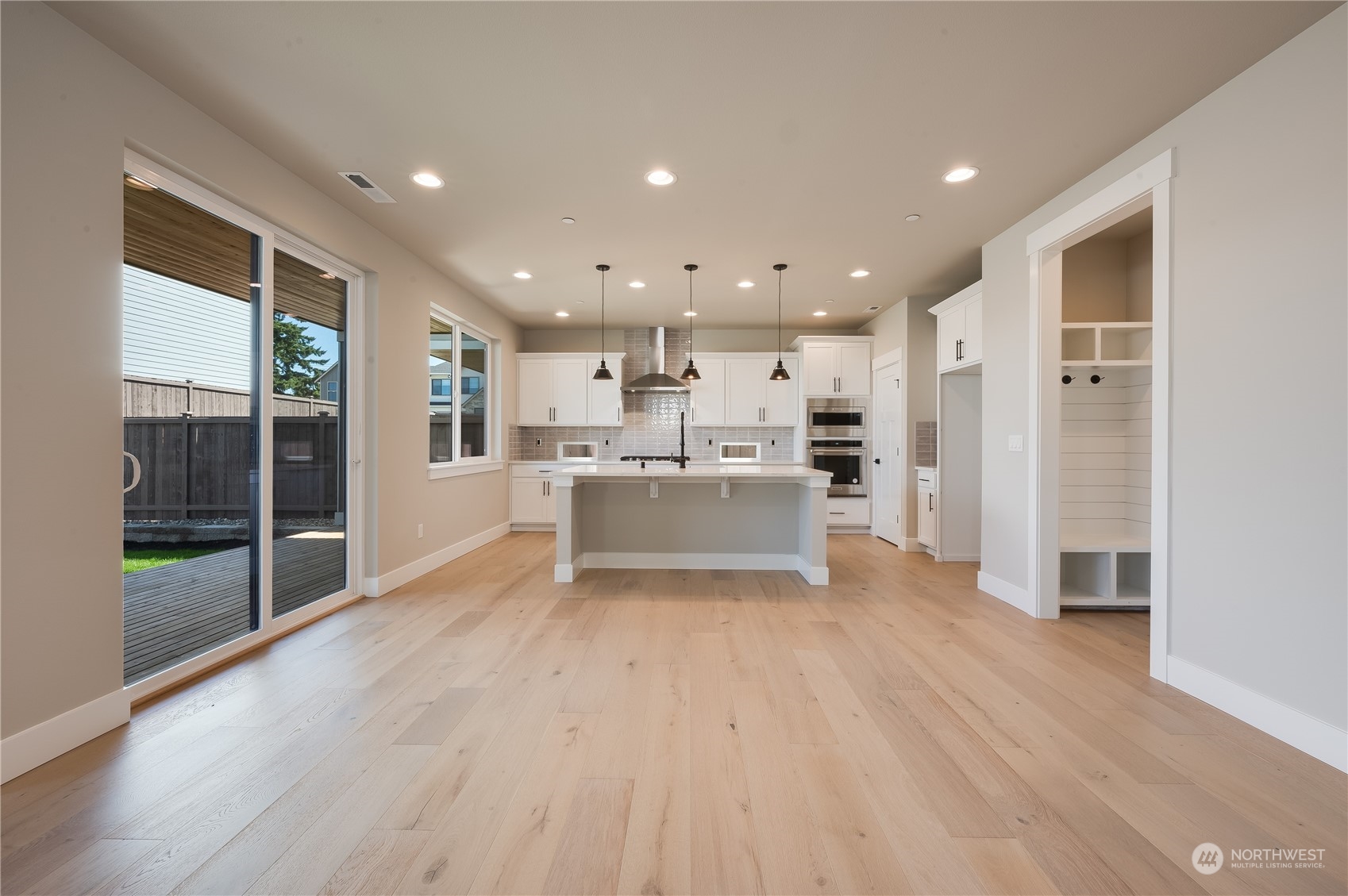 4433 244th Street Southeast, Unit LOT02 Bothell, WA 98021 - Photo 12 of 40 a view of kitchen with wooden floor