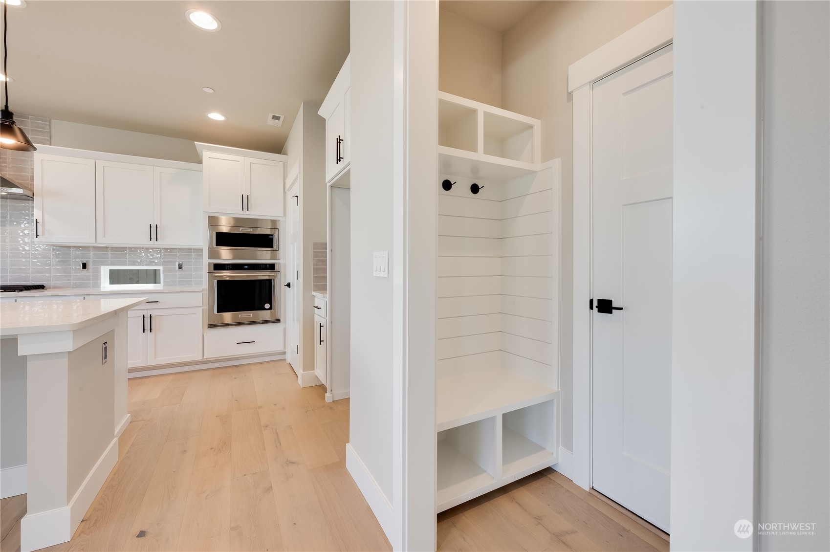 4433 244th Street Southeast, Unit LOT02 Bothell, WA 98021 - Photo 20 of 40 a view of a kitchen with wooden floor