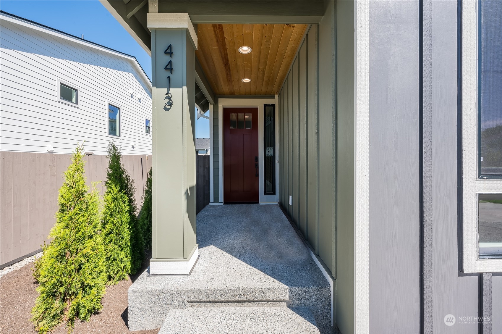 4433 244th Street Southeast, Unit LOT02 Bothell, WA 98021 - Photo 2 of 40 a view of a hallway with potted plants