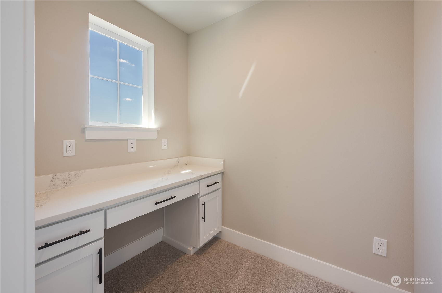 4433 244th Street Southeast, Unit LOT02 Bothell, WA 98021 - Photo 22 of 40 a room with a sink cabinets and a window