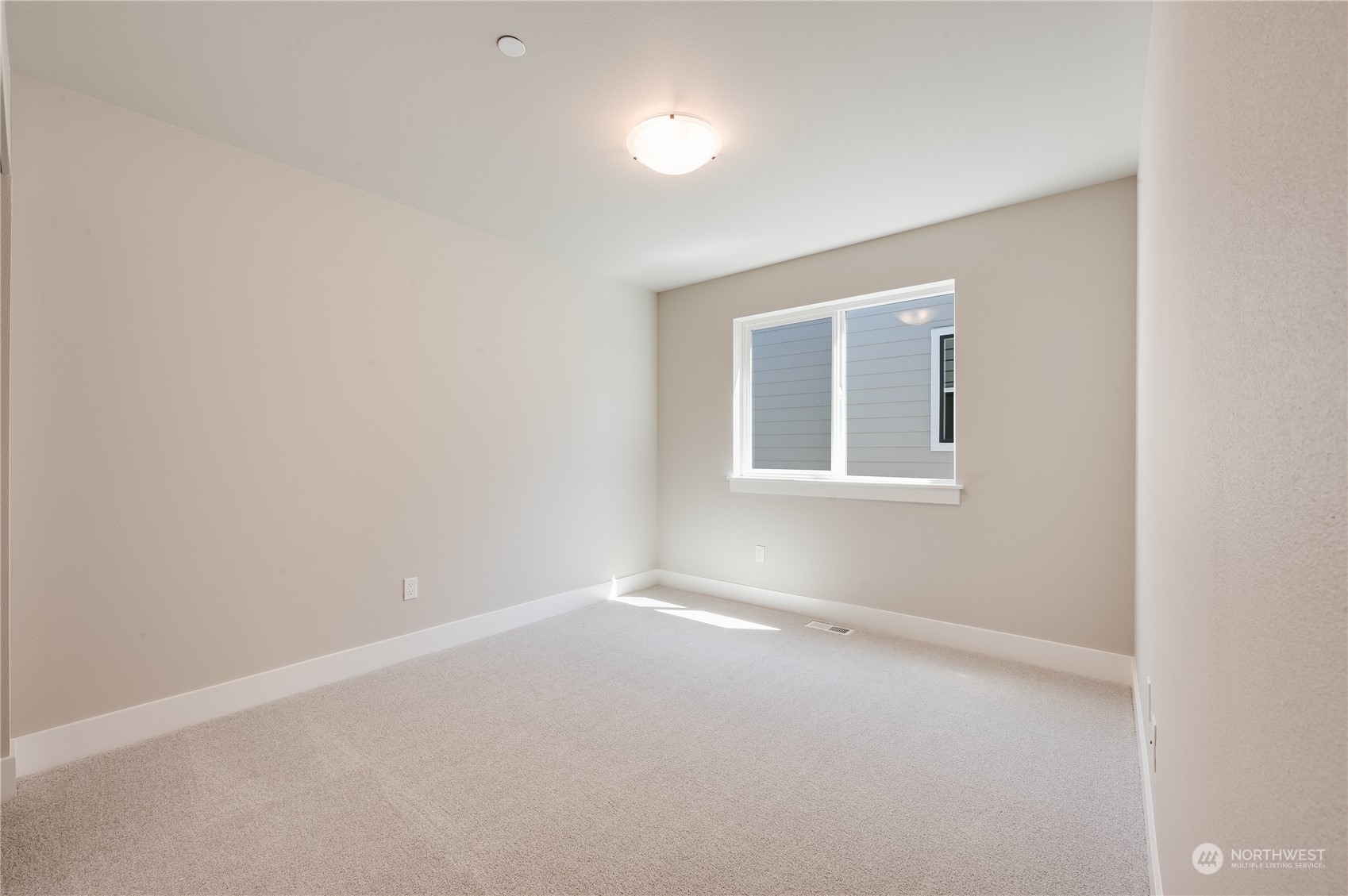 4433 244th Street Southeast, Unit LOT02 Bothell, WA 98021 - Photo 24 of 40 an empty room with a window