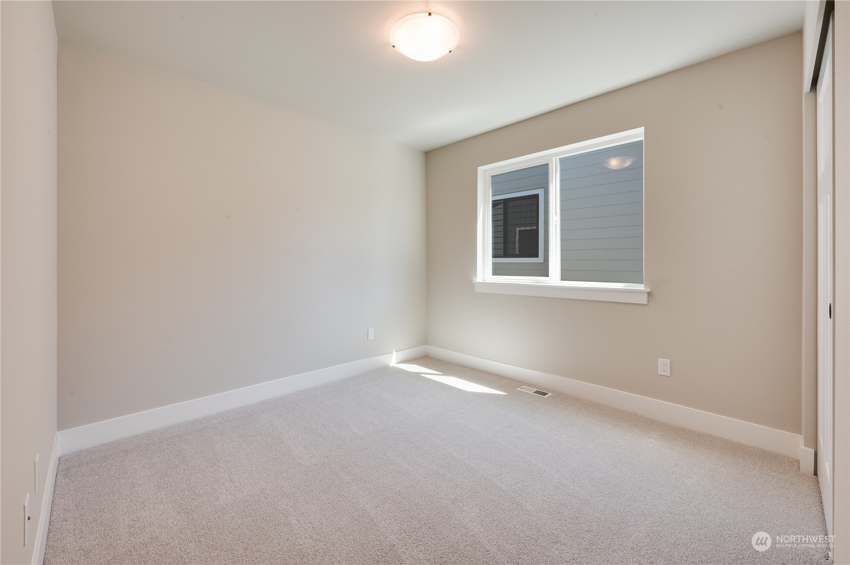 4433 244th Street Southeast, Unit LOT02 Bothell, WA 98021 - Photo 25 of 40 an empty room with a window