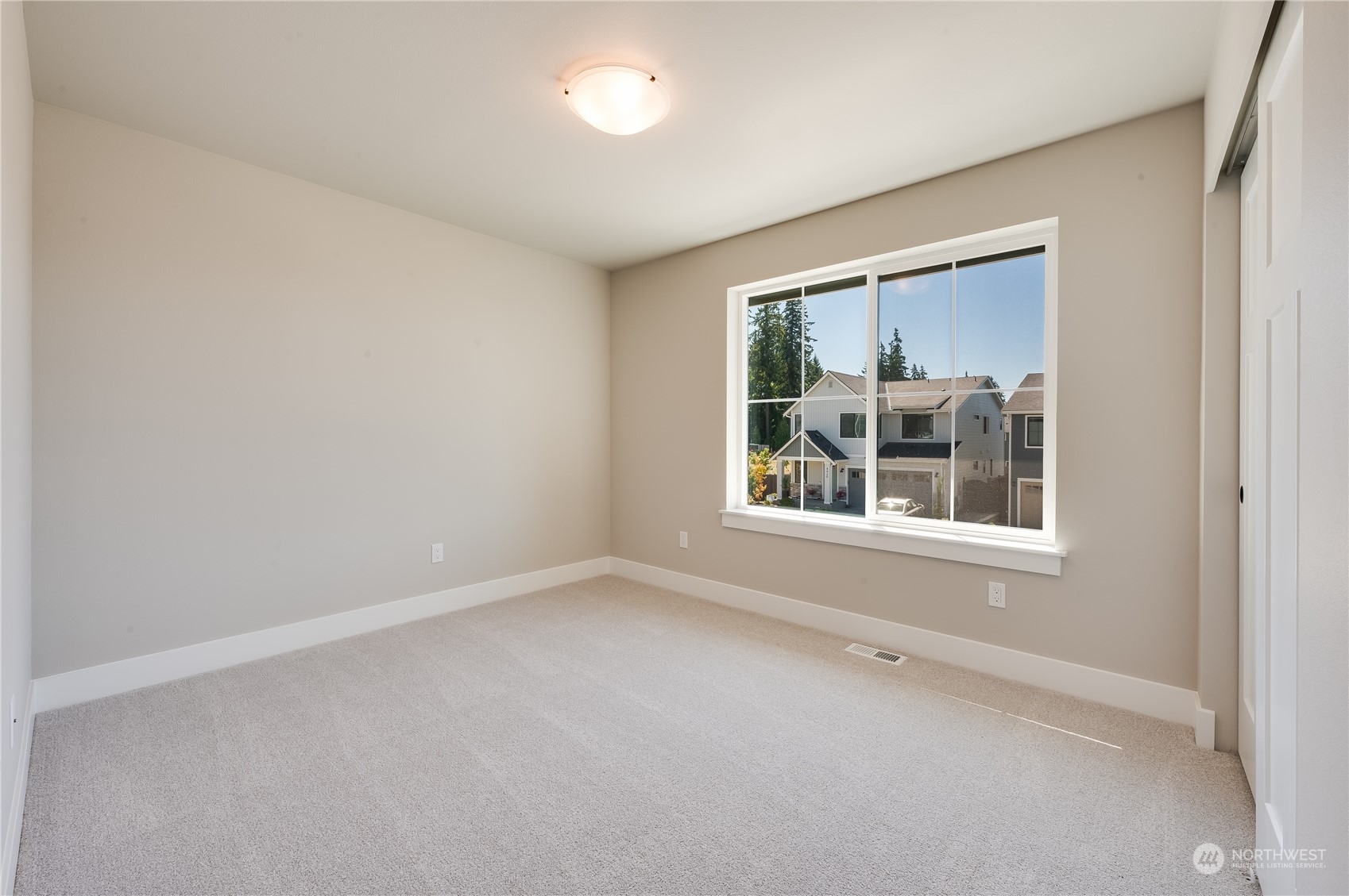 4433 244th Street Southeast, Unit LOT02 Bothell, WA 98021 - Photo 26 of 40 an empty room with a window