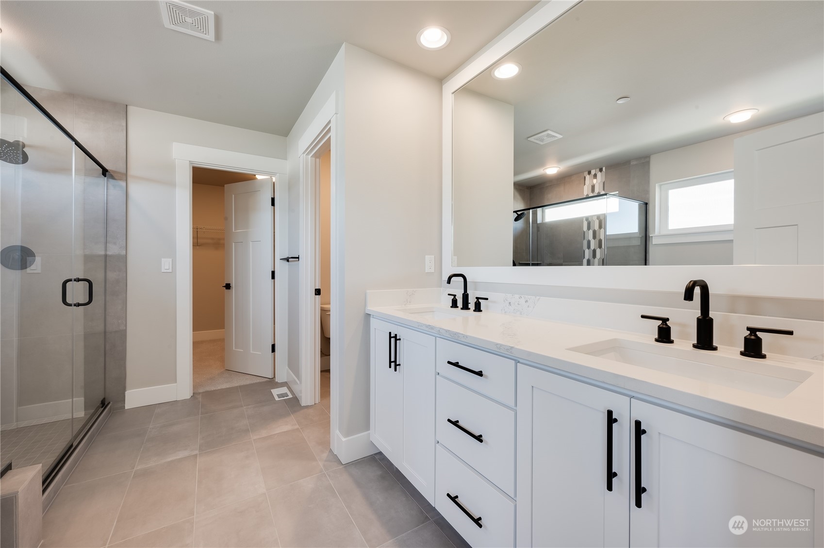 4433 244th Street Southeast, Unit LOT02 Bothell, WA 98021 - Photo 29 of 40 a spacious bathroom with double sink and shower