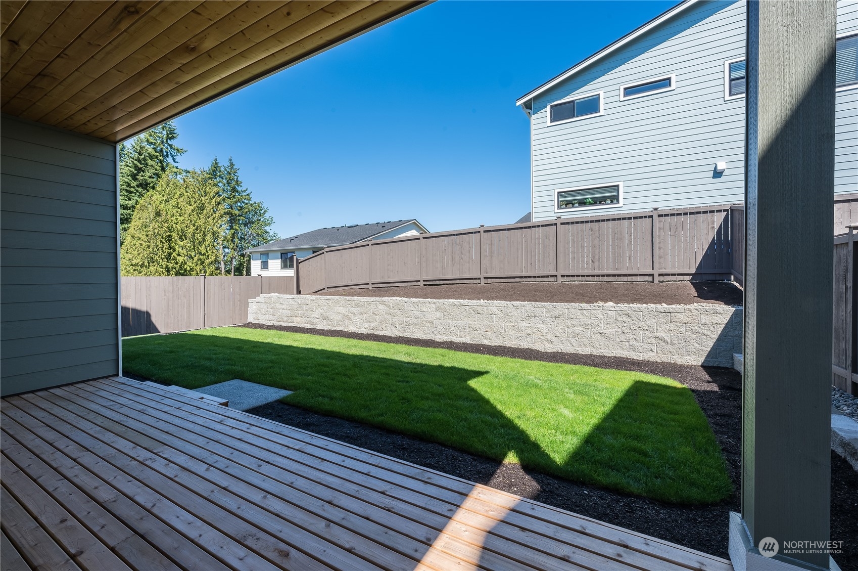 4433 244th Street Southeast, Unit LOT02 Bothell, WA 98021 - Photo 31 of 40 a view of a backyard with sitting area
