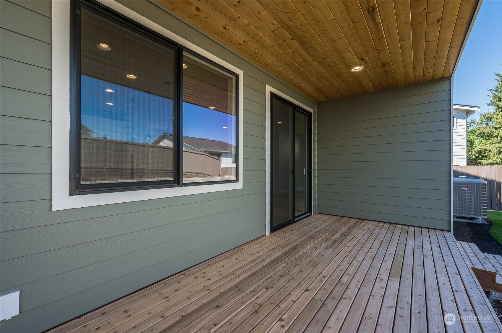 4433 244th Street Southeast, Unit LOT02 Bothell, WA 98021 - Photo 32 of 40 a view of a house with a wooden deck