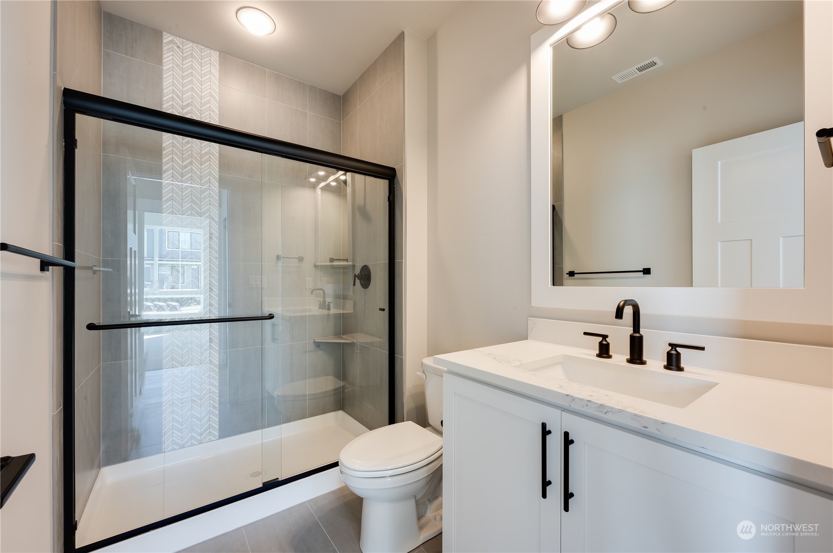 4433 244th Street Southeast, Unit LOT02 Bothell, WA 98021 - Photo 5 of 40 a bathroom with a sink toilet and shower