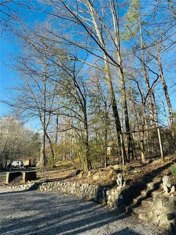 a view of a house with a yard and garage