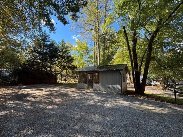 a backyard of a house with lots of green space