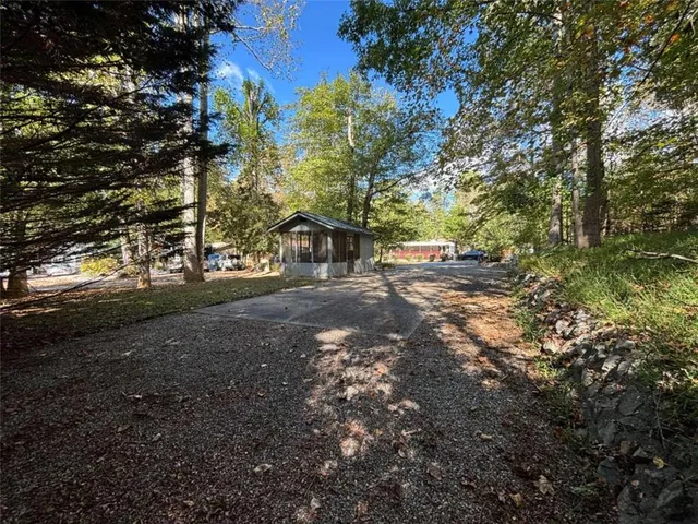 a house with trees in the background