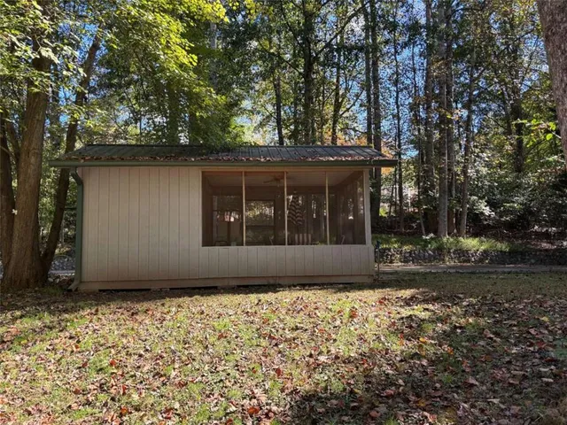 a view of a room with furniture and wooden floor