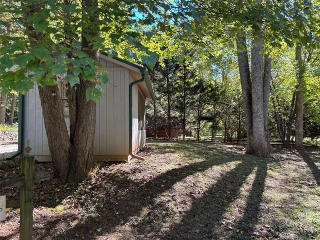a view of a swimming pool with a yard