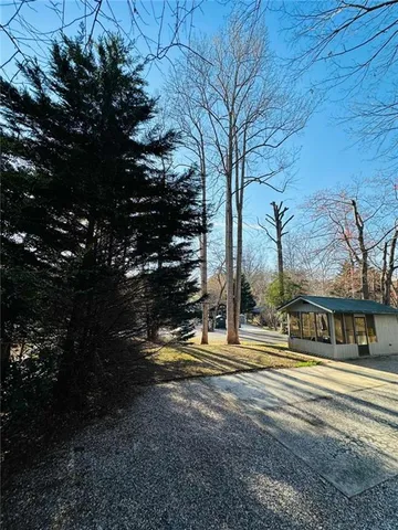a view of a house with a backyard porch and sitting area