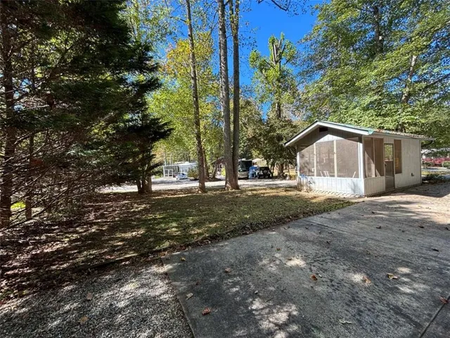 a view of outdoor space with a table and chairs