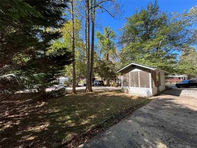 a view of a patio with a table and chairs
