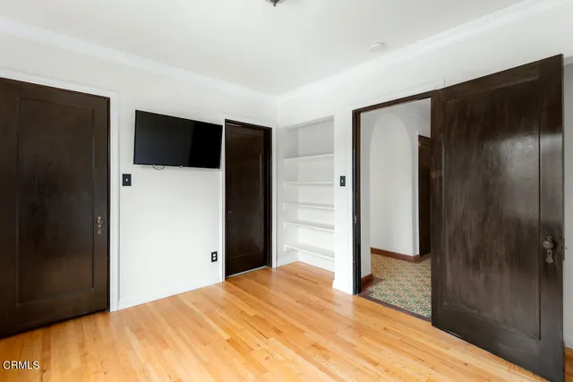 a view of hallway with wooden floor