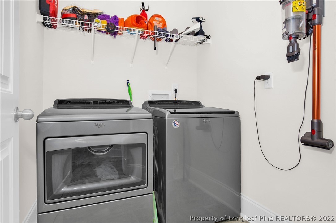 126 Verdmont Drive Raeford, NC 28376 - Photo 16 of 30 a utility room with dryer and washer