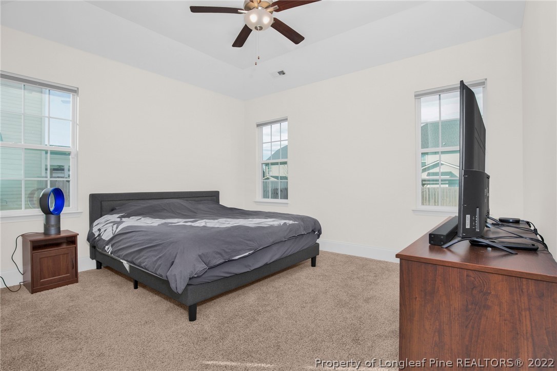 126 Verdmont Drive Raeford, NC 28376 - Photo 21 of 30 a bedroom with a bed and a window
