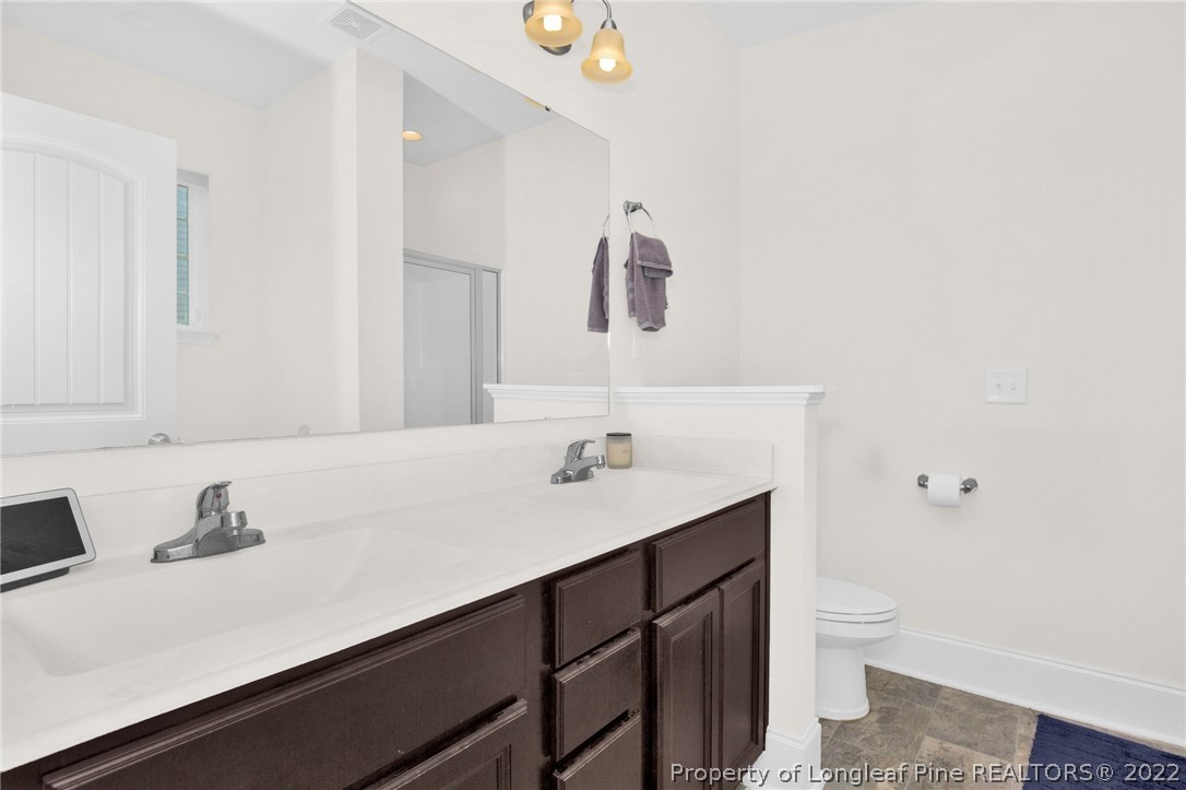 126 Verdmont Drive Raeford, NC 28376 - Photo 23 of 30 a bathroom with a sink and a toilet