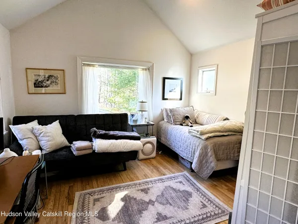 a living room with furniture and a rug