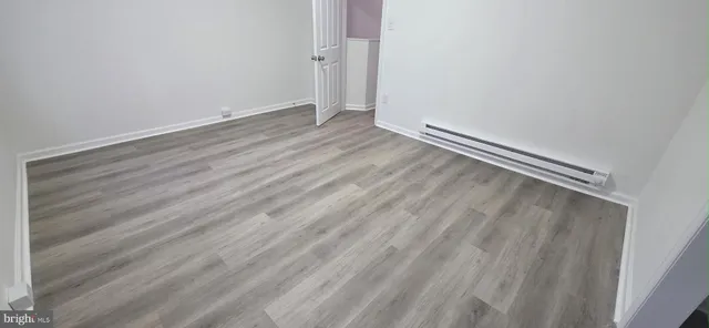 a view of room with wooden floor