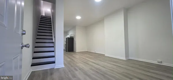 an empty room with wooden floor