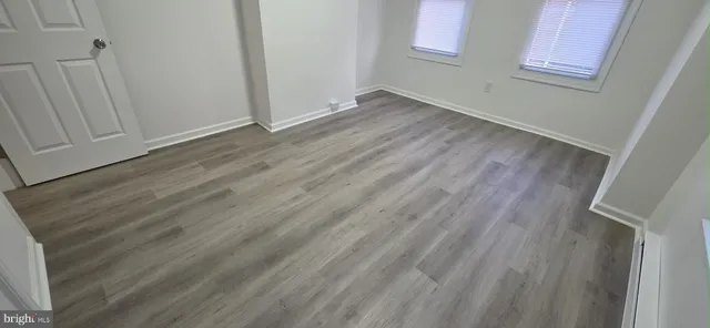 a view of room with wooden floor